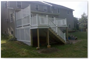 DECK RENOVATION - This deck now has a composite deck with PVC railings and a privacy lattice.