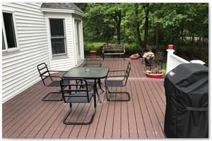 DECK REBUILD - ...We completed the new deck with a wide staircase applied a white Azek skirting.
