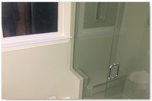 BATHROOM RENOVATION - Custom Corian shower with custom glass doors.

