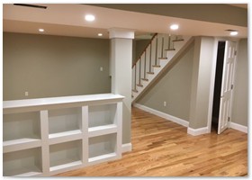 Basement Remodel with hardwood floors and plenty of lighting.