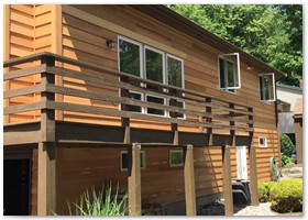 EXTERIOR RENOVATION - We install new Azek on the rake boards and 8 inch raw cedar to the two walls attached with stainless steel nails
